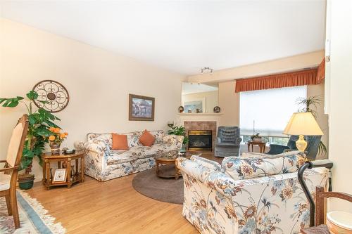 107-2300 Benvoulin Road, Kelowna, BC - Indoor Photo Showing Living Room With Fireplace