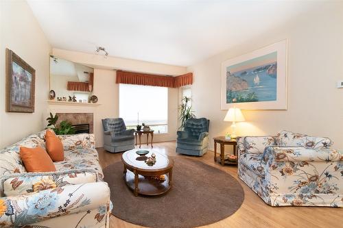 107-2300 Benvoulin Road, Kelowna, BC - Indoor Photo Showing Living Room With Fireplace