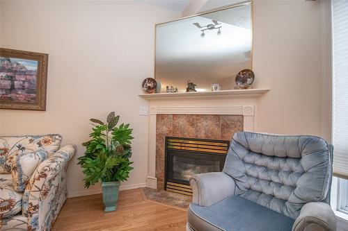 107-2300 Benvoulin Road, Kelowna, BC - Indoor Photo Showing Living Room With Fireplace