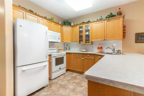 107-2300 Benvoulin Road, Kelowna, BC - Indoor Photo Showing Kitchen With Double Sink