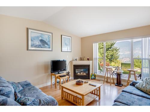 111 - 4200 Grandview Drive, Castlegar, BC - Indoor Photo Showing Living Room With Fireplace