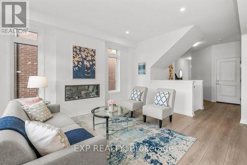 48 - 4552 Portage Road, Niagara Falls, ON - Indoor Photo Showing Living Room With Fireplace