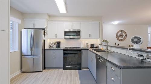 210-686 Lequime Road, Kelowna, BC - Indoor Photo Showing Kitchen With Double Sink