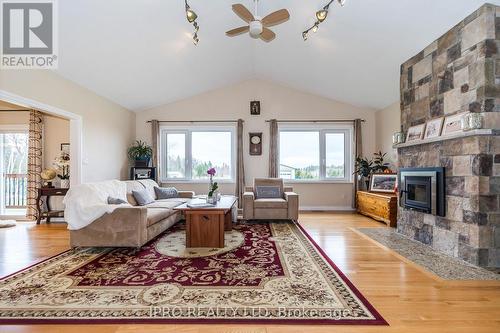 434424 4 Line, Amaranth, ON - Indoor Photo Showing Living Room With Fireplace