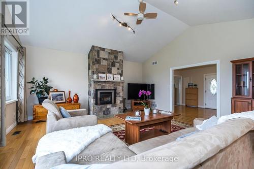 434424 4 Line, Amaranth, ON - Indoor Photo Showing Living Room With Fireplace