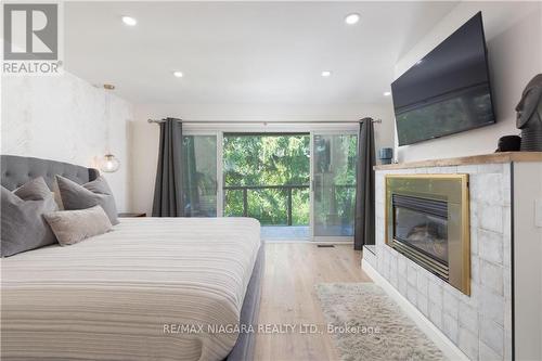 1647 Gregory Road, St. Catharines, ON - Indoor Photo Showing Bedroom With Fireplace