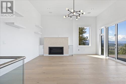 2302 Lavetta Drive, Kelowna, BC - Indoor Photo Showing Living Room With Fireplace