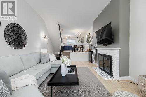 9 - 4 Paradise Boulevard, Ramara (Brechin), ON - Indoor Photo Showing Living Room With Fireplace