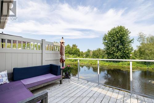 9 - 4 Paradise Boulevard, Ramara (Brechin), ON - Outdoor With Body Of Water With Deck Patio Veranda