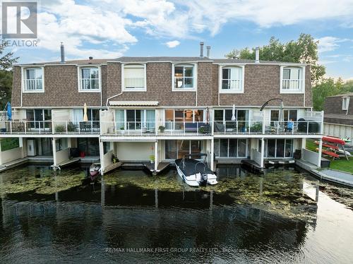 9 - 4 Paradise Boulevard, Ramara (Brechin), ON - Outdoor With Body Of Water With Deck Patio Veranda