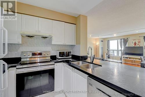 Ph#105 - 1 Lee Centre Drive, Toronto (Woburn), ON - Indoor Photo Showing Kitchen With Double Sink