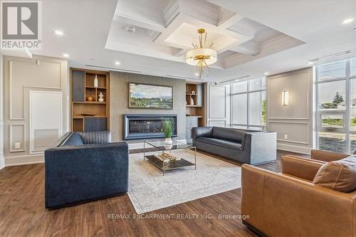 906 - 470 Dundas Street E, Hamilton (Waterdown), ON - Indoor Photo Showing Living Room With Fireplace