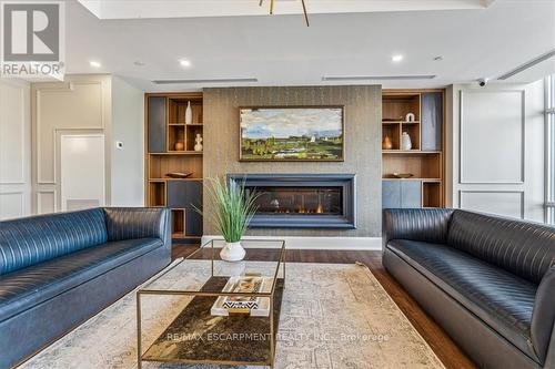 906 - 470 Dundas Street E, Hamilton (Waterdown), ON - Indoor Photo Showing Living Room With Fireplace