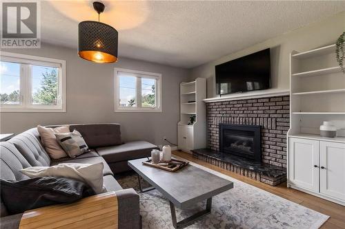 11 Highland Drive, Salisbury, NB - Indoor Photo Showing Living Room With Fireplace