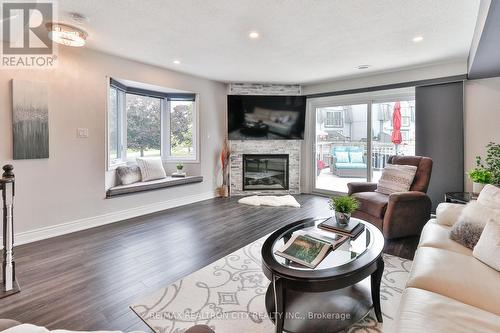 7 - 24 Laguna Parkway, Ramara (Brechin), ON - Indoor Photo Showing Living Room With Fireplace