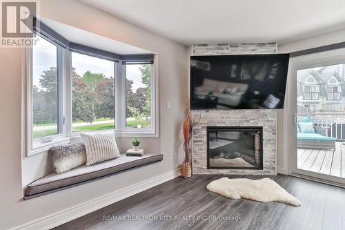 7 - 24 Laguna Parkway, Ramara (Brechin), ON - Indoor Photo Showing Living Room With Fireplace