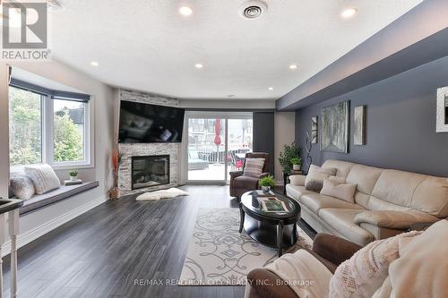 7 - 24 Laguna Parkway, Ramara (Brechin), ON - Indoor Photo Showing Living Room With Fireplace