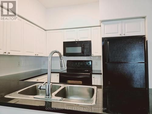 Gv128 - 17 Barberry Place, Toronto, ON - Indoor Photo Showing Kitchen With Double Sink