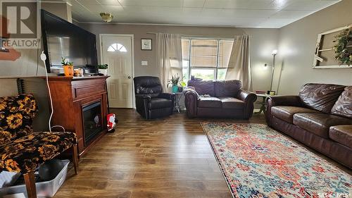 30 Railway Avenue, Success, SK - Indoor Photo Showing Living Room With Fireplace