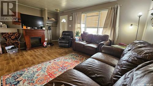 30 Railway Avenue, Success, SK - Indoor Photo Showing Living Room With Fireplace