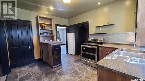 1271 104Th Street, North Battleford, SK - Indoor Photo Showing Kitchen With Double Sink