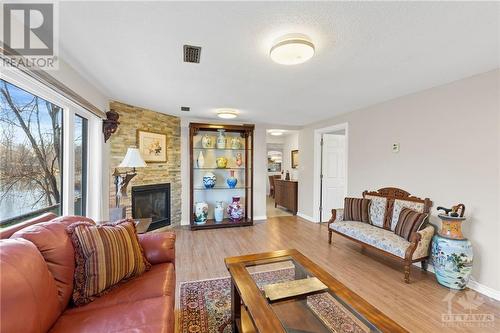 4229 Rideau Valley Drive, Ottawa, ON - Indoor Photo Showing Living Room With Fireplace