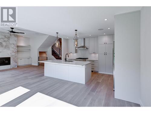 451 Vision Court, Kelowna, BC - Indoor Photo Showing Kitchen With Fireplace With Upgraded Kitchen