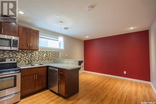 5117 Aerial Crescent, Regina, SK - Indoor Photo Showing Kitchen With Double Sink