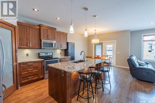 5117 Aerial Crescent, Regina, SK - Indoor Photo Showing Kitchen With Stainless Steel Kitchen With Double Sink With Upgraded Kitchen