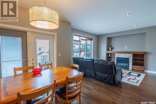 5117 Aerial Crescent, Regina, SK - Indoor Photo Showing Dining Room With Fireplace