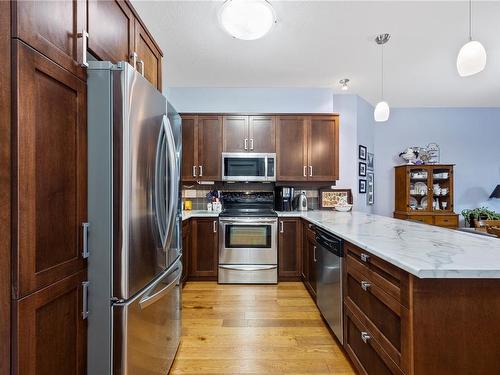 101-6310 Mcrobb Ave, Nanaimo, BC - Indoor Photo Showing Kitchen With Stainless Steel Kitchen With Upgraded Kitchen