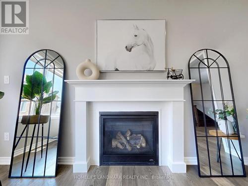 1281 Whitney Terrace, Milton (Ford), ON - Indoor Photo Showing Living Room With Fireplace