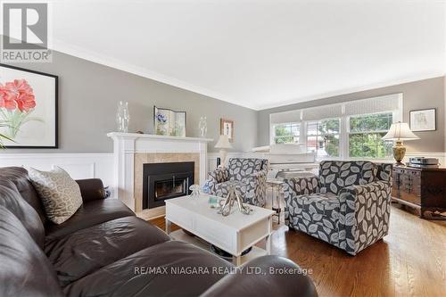 19 Queen Mary Drive, St. Catharines, ON - Indoor Photo Showing Living Room With Fireplace