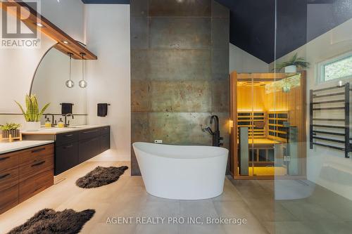 Primary bath  statement wall and sauna - 45 Blackburn Crescent, Middlesex Centre (Kilworth), ON - Indoor Photo Showing Bathroom