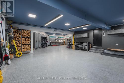 4 car Garage with built in storage, bike rack - 45 Blackburn Crescent, Middlesex Centre (Kilworth), ON - Indoor Photo Showing Garage