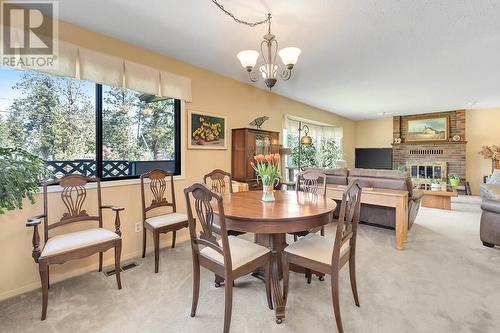 655 Barnaby Road, Kelowna, BC - Indoor Photo Showing Dining Room With Fireplace