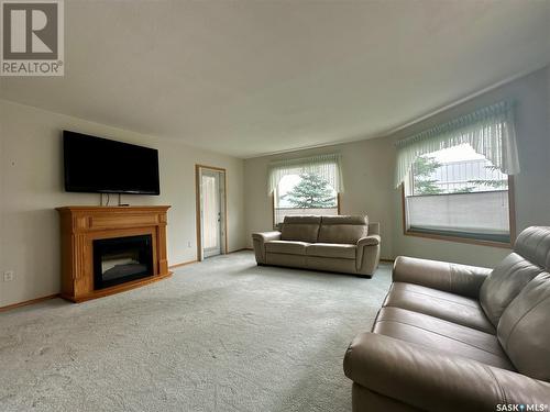 106 4451 Nicurity Drive, Regina, SK - Indoor Photo Showing Living Room With Fireplace