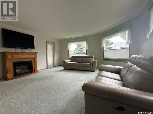 106 4451 Nicurity Drive, Regina, SK - Indoor Photo Showing Living Room With Fireplace