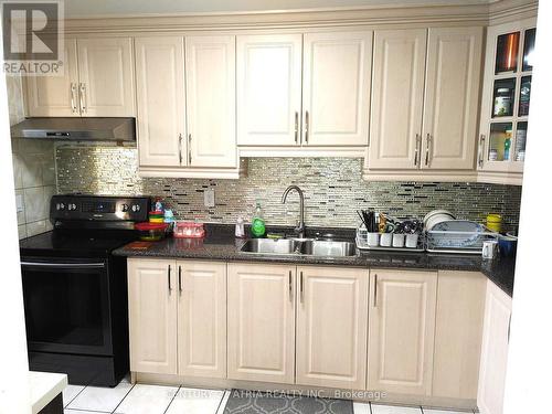 209 - 120 Dundalk Drive, Toronto (Dorset Park), ON - Indoor Photo Showing Kitchen With Double Sink