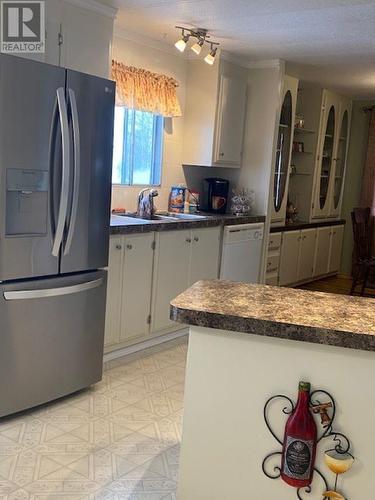 12213 Pacific Avenue, Fort St. John, BC - Indoor Photo Showing Kitchen With Double Sink