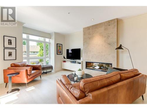 2901 Abbott Street Unit# 112, Kelowna, BC - Indoor Photo Showing Living Room With Fireplace