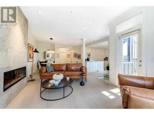 2901 Abbott Street Unit# 112, Kelowna, BC - Indoor Photo Showing Living Room With Fireplace