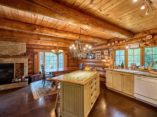 Kitchen - 1000 Ch. Des Rives, Notre-Dame-De-La-Merci, QC - Indoor With Fireplace