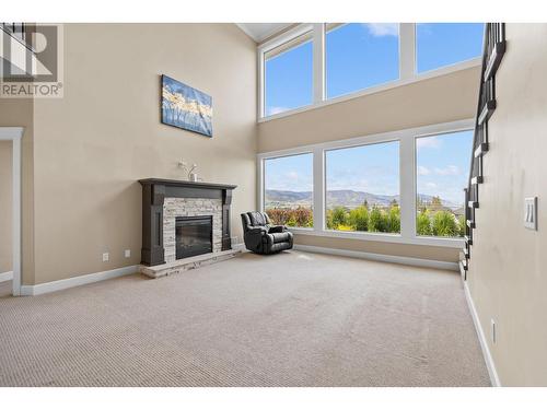 368 Trumpeter Court, Kelowna, BC - Indoor Photo Showing Other Room With Fireplace