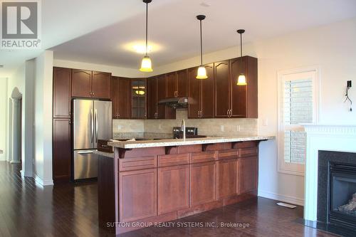 2429 Presquile Drive, Oakville, ON - Indoor Photo Showing Kitchen With Fireplace With Upgraded Kitchen