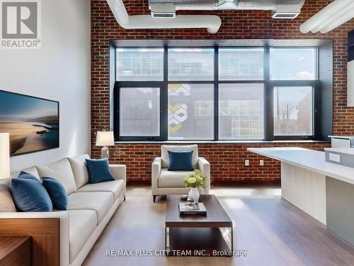 206 - 150 Logan Avenue, Toronto, ON - Indoor Photo Showing Living Room