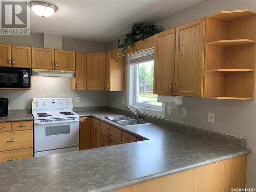 909 Prince Street, Hudson Bay, SK - Indoor Photo Showing Kitchen With Double Sink