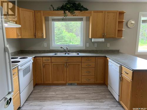 909 Prince Street, Hudson Bay, SK - Indoor Photo Showing Kitchen With Double Sink