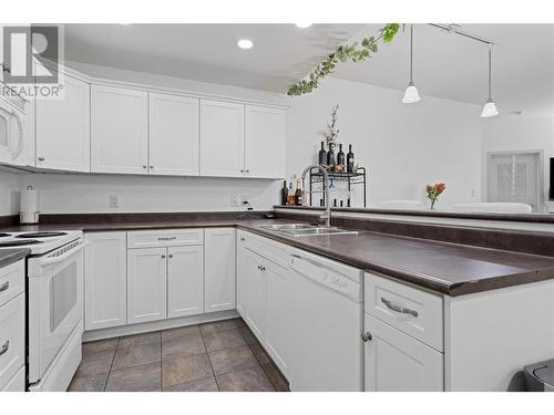 345 Mills Road Unit# 305, Kelowna, BC - Indoor Photo Showing Kitchen With Double Sink