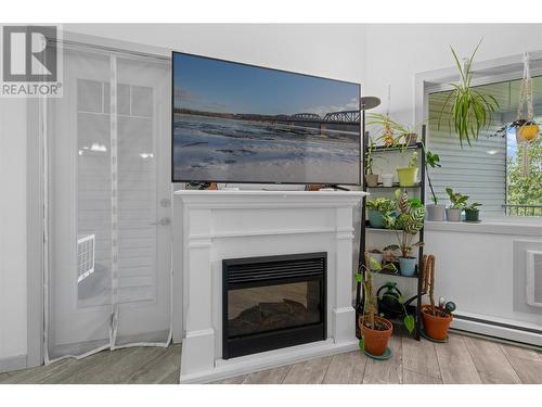 345 Mills Road Unit# 305, Kelowna, BC - Indoor Photo Showing Living Room With Fireplace